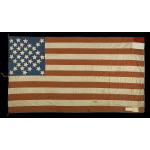 35 STARS, MADE BY MRS. JOHN DRUM, POSSIBLY IN PENNSYLVANIA, WITH A SPECTACULARLY RARE AND INTERESTING DIAMOND CONFIGURATION OF STARS AND HAND-WRITTEN NOTES SEWN TO THE LAST STRIPE; RECORDED AS FLOWN TO MOURN THE DEATH OF THREE PRESIDENTS AND IN CELEBRATIO Preview