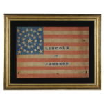 ONE OF THE LARGEST KNOWN PARADE FLAGS MADE FOR THE 1864 CAMPAIGN OF ABRAHAM LINCOLN & ANDREW JOHNSON, 34 STARS IN A MEDALLION CONFIGURATION ON A CHROME BLUE CANTON WITH MATCHING BLUE TEXT, AN EXTRAORDINARY EXAMPLE: Preview